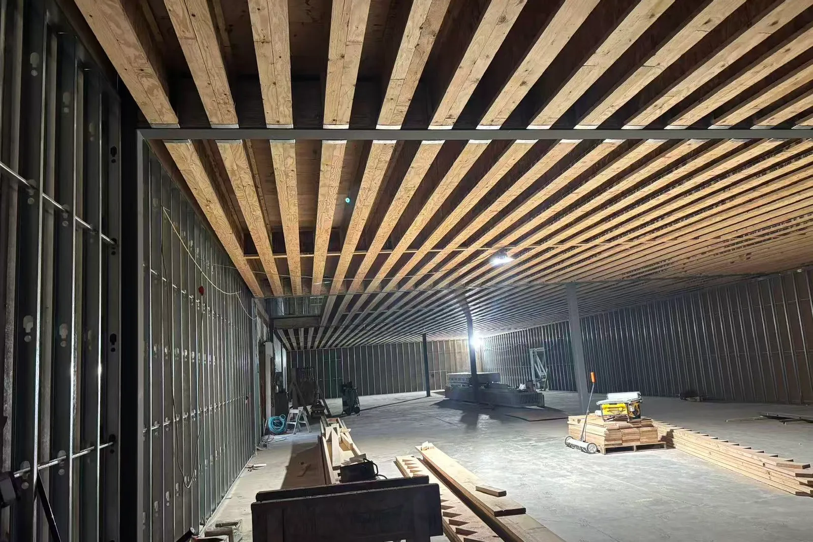 Interior of a Titrin construction build, exposed timber ceiling over steel framing